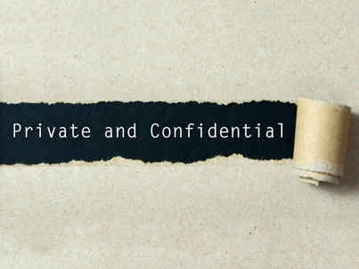Private and confidential written on torn paper black background